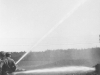 Drafting with two inch and a half lines off the American-LaFrance at a creek near Armstrong - May 1953. b