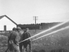 Drafting with two inch and a half lines off the American-LaFrance at a creek near Armstrong - May 1953.
