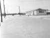 Main gate (in the background) and the Orderly Room building - January 1953.