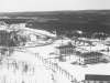 The road to the village of Armstrong looking west past the Orderly Room and the main gate as seen from the cliff - 29 March 1953.